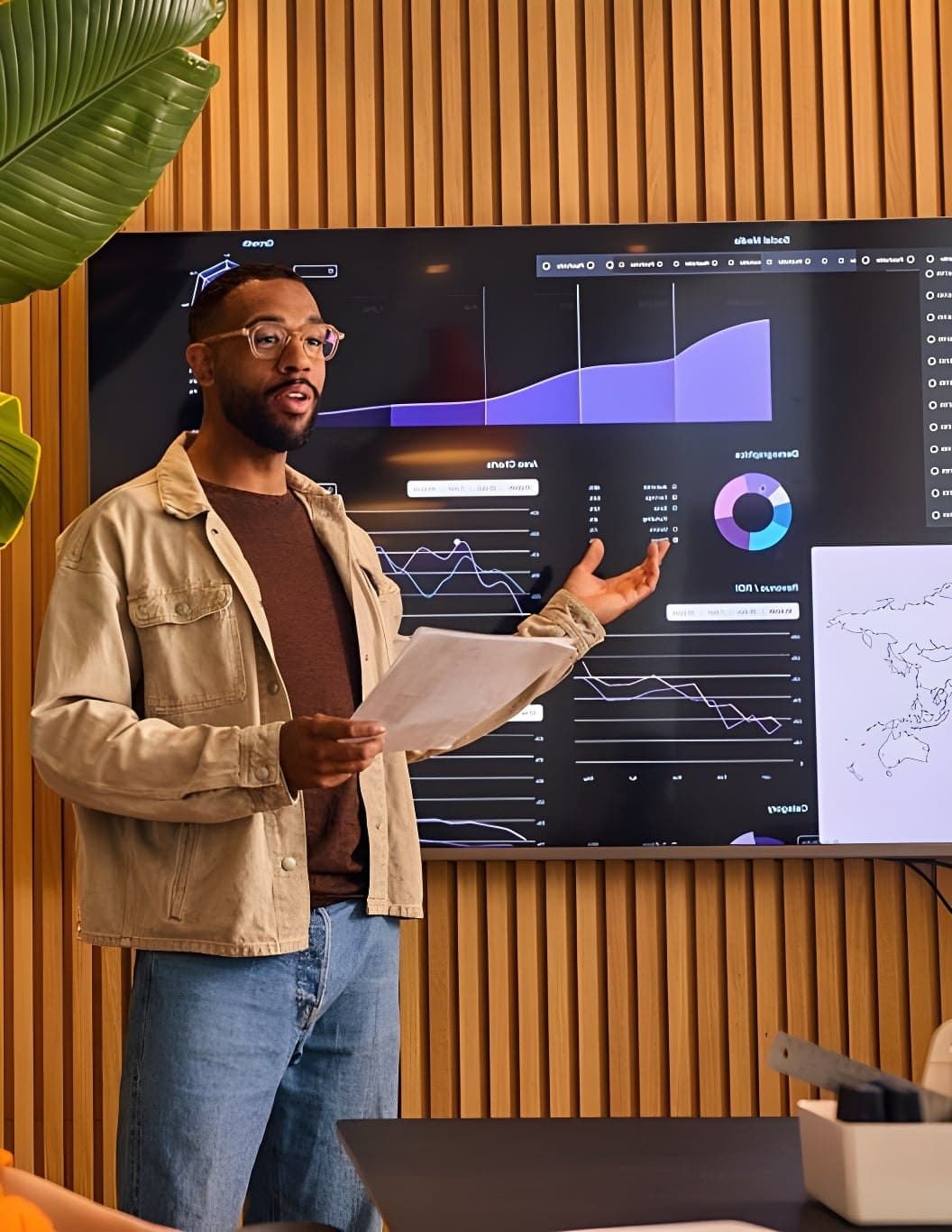 A professional presenting performance data to colleagues